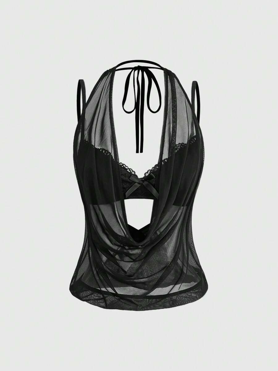 Women wearing a black draped backless halter crop top layered over a boned lace camisole.