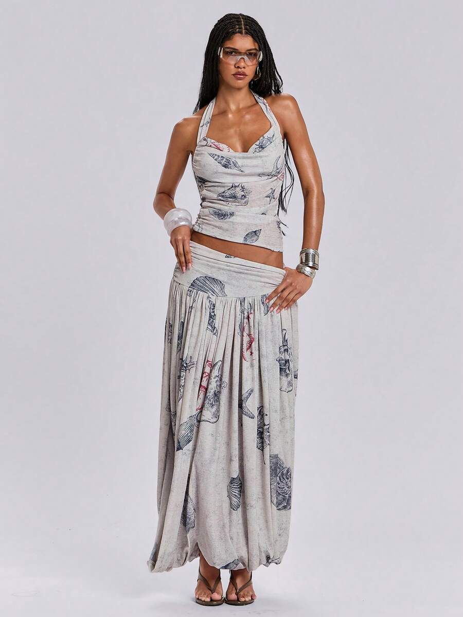 Blue halter cami tank top for women featuring an ocean fish and starfish print, spaghetti straps, slim fit knitted fabric, and a backless lace-up tie design.
