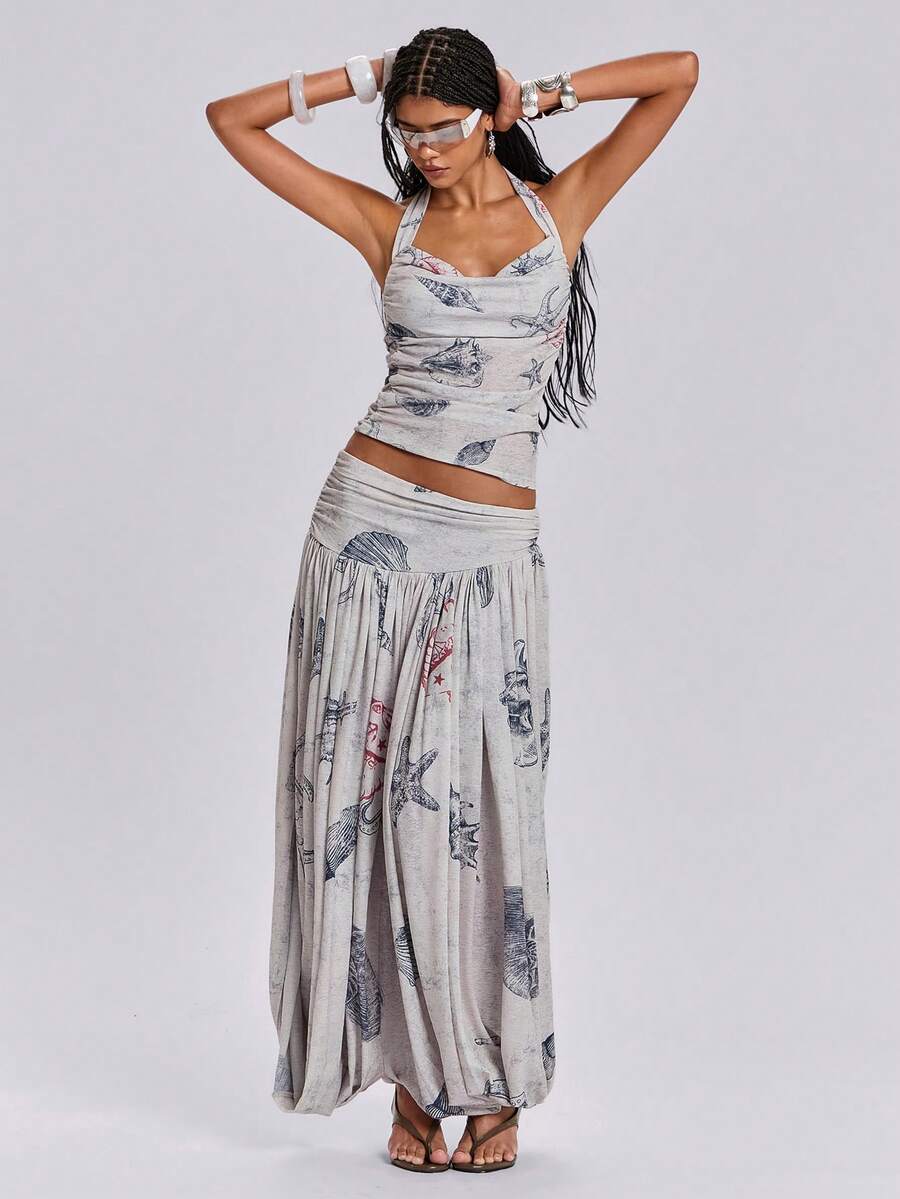 Blue halter cami tank top for women featuring an ocean fish and starfish print, spaghetti straps, slim fit knitted fabric, and a backless lace-up tie design.