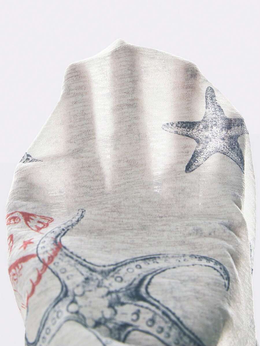 Blue halter cami tank top for women featuring an ocean fish and starfish print, spaghetti straps, slim fit knitted fabric, and a backless lace-up tie design.