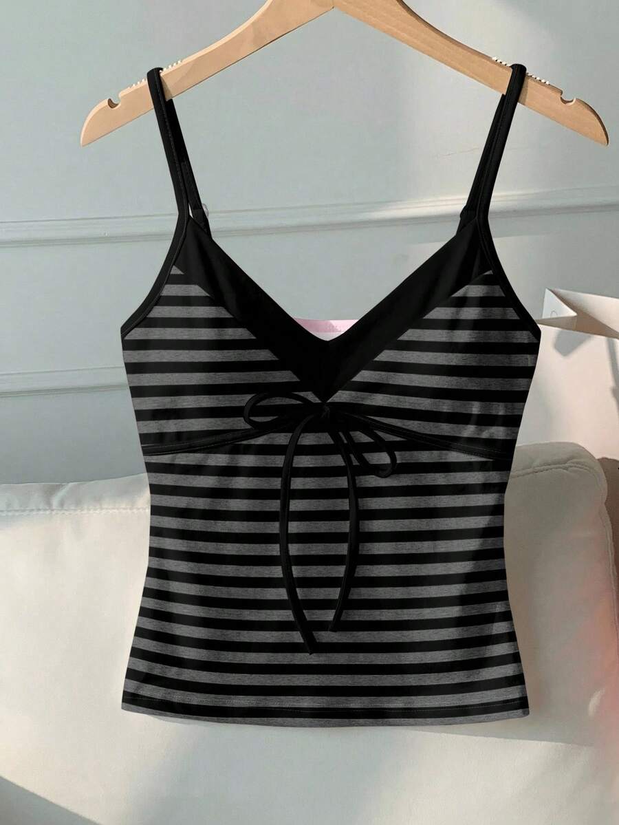 Black and white polka dot tie strap camisole top for women with thin spaghetti straps and slim fit.