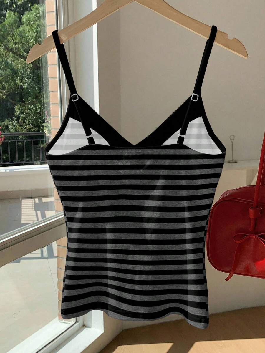Black and white polka dot tie strap camisole top for women with thin spaghetti straps and slim fit.