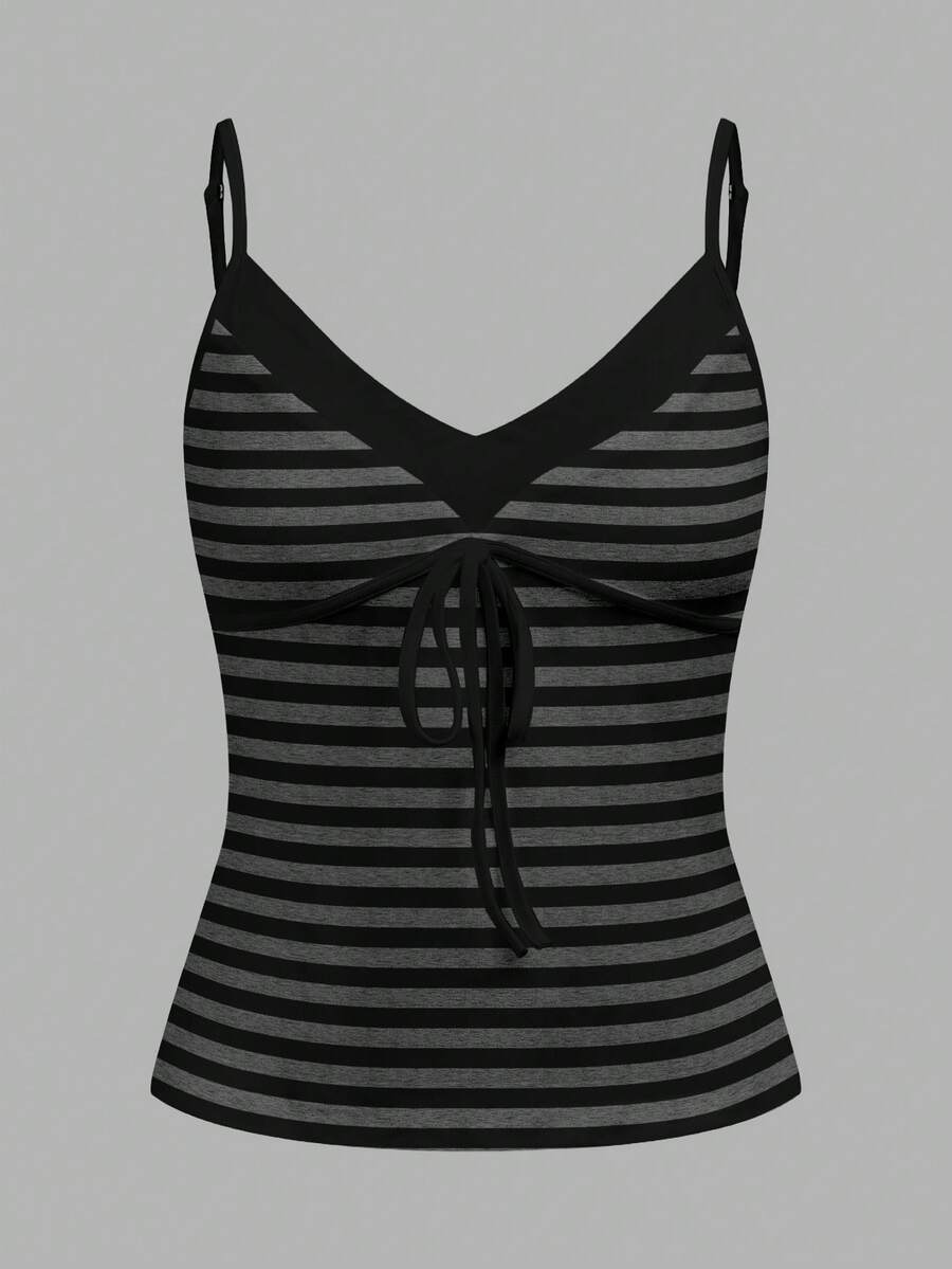 Black and white polka dot tie strap camisole top for women with thin spaghetti straps and slim fit.