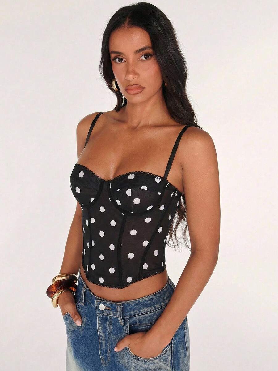 Black women’s lace cami top with spaghetti straps, contrast lace details, and an asymmetrical hem, styled as a slim-fit lined casual top.