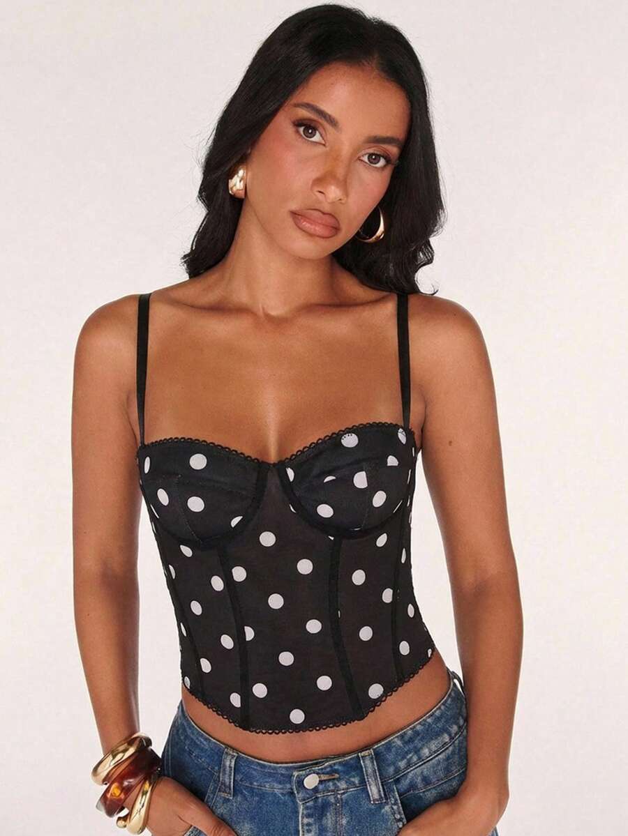 Black women’s lace cami top with spaghetti straps, contrast lace details, and an asymmetrical hem, styled as a slim-fit lined casual top.