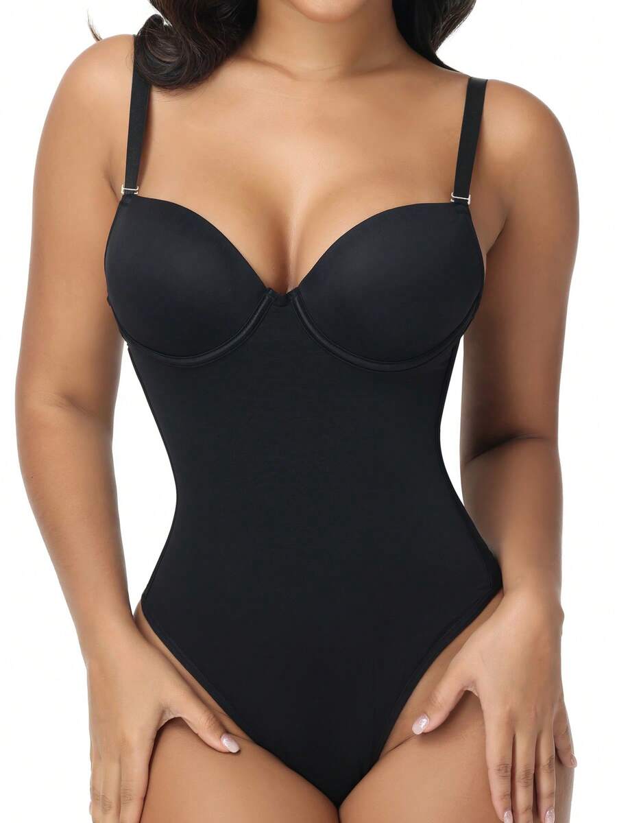 Black shapewear bodysuit for women featuring a built-in push-up bra, back tie, zipper closure, and Bermuda shorts length.