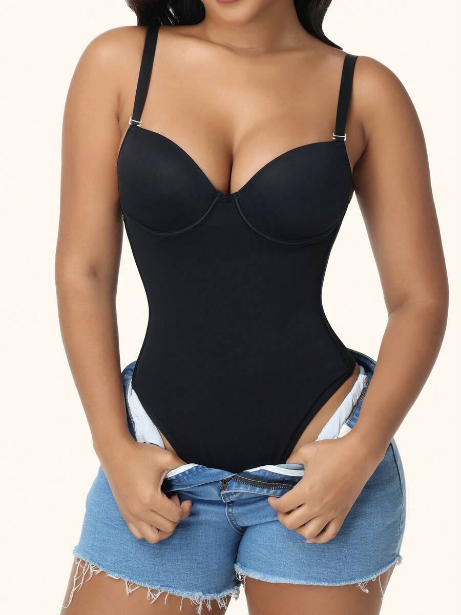 Black shapewear bodysuit for women featuring a built-in push-up bra, back tie, zipper closure, and Bermuda shorts length.