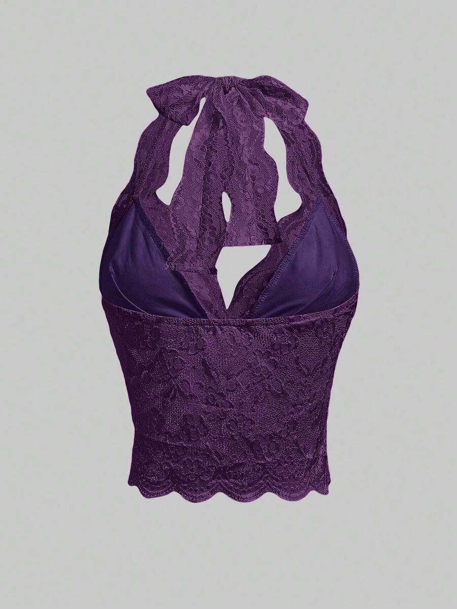 Women's black lace halter neck camisole featuring a backless crop silhouette, contrast lace trim, and scallop hem.