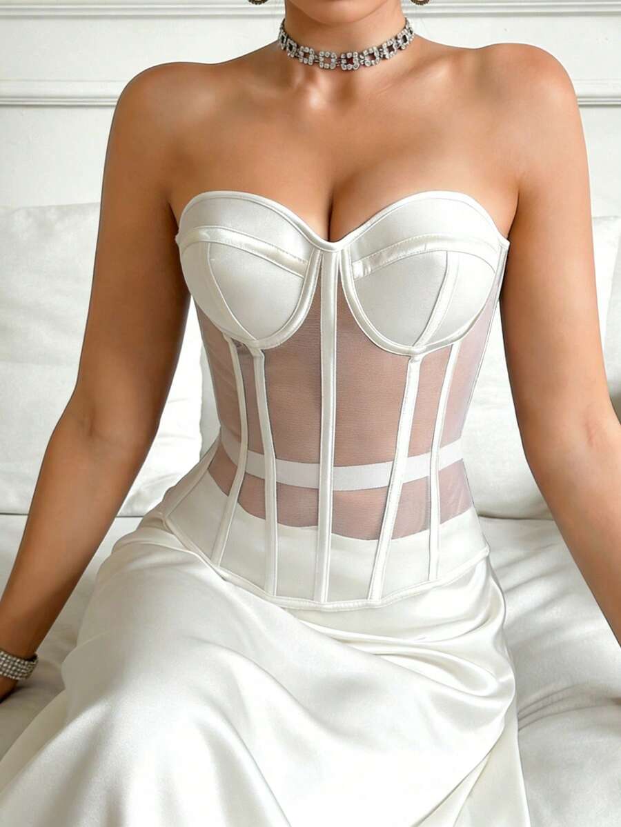 Beige strapless sheer mesh corset top for women featuring front boning, lace-up grommet eyelet detail, and push-up padded cups.