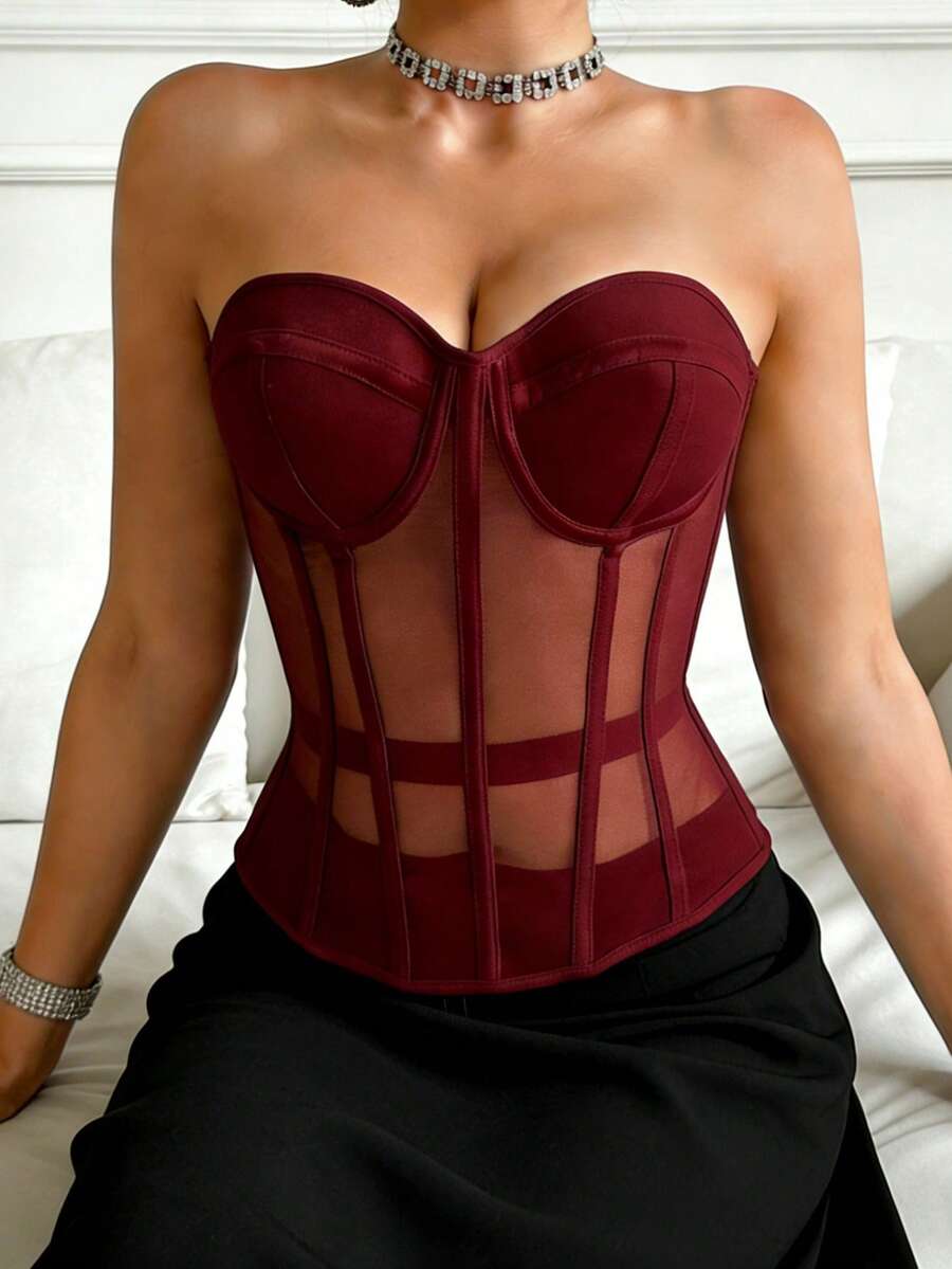 Beige strapless sheer mesh corset top for women featuring front boning, lace-up grommet eyelet detail, and push-up padded cups.
