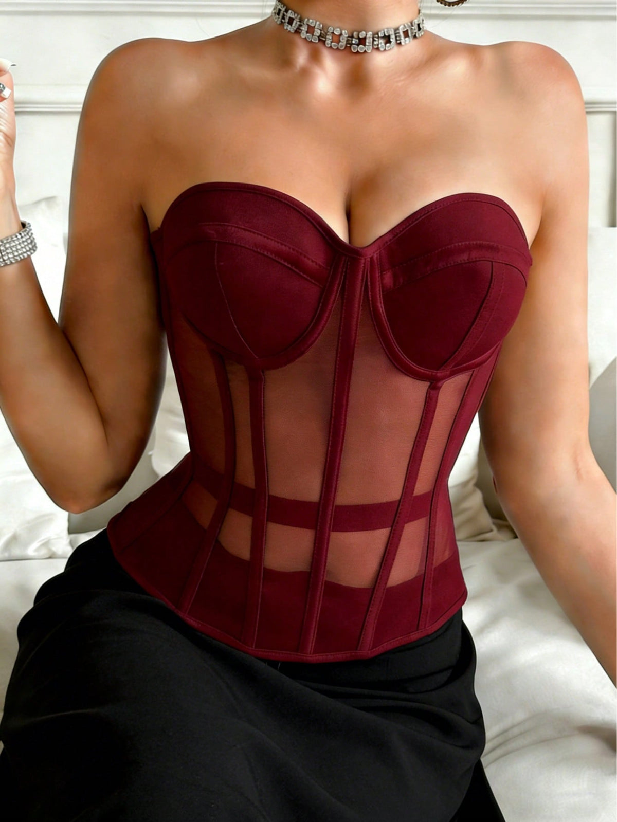 Beige strapless sheer mesh corset top for women featuring front boning, lace-up grommet eyelet detail, and push-up padded cups.