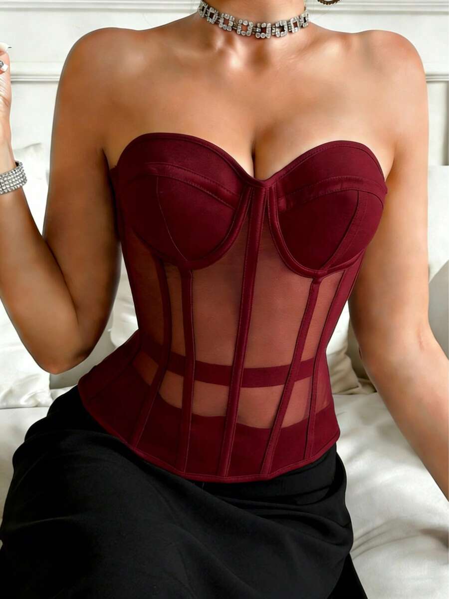 Beige strapless sheer mesh corset top for women featuring front boning, lace-up grommet eyelet detail, and push-up padded cups.