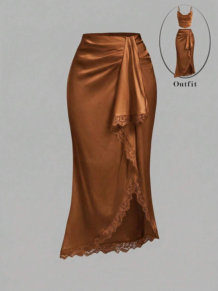 Women's elegant pink satin asymmetrical long skirt featuring contrast lace patchwork, ruched knot detailing, and a mid-waist mermaid cut.