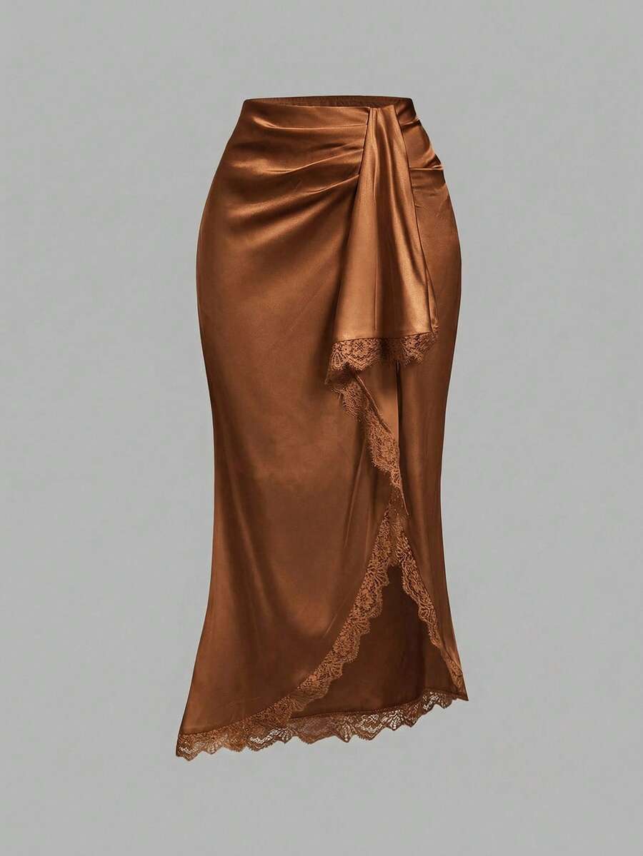 Women's elegant pink satin asymmetrical long skirt featuring contrast lace patchwork, ruched knot detailing, and a mid-waist mermaid cut.