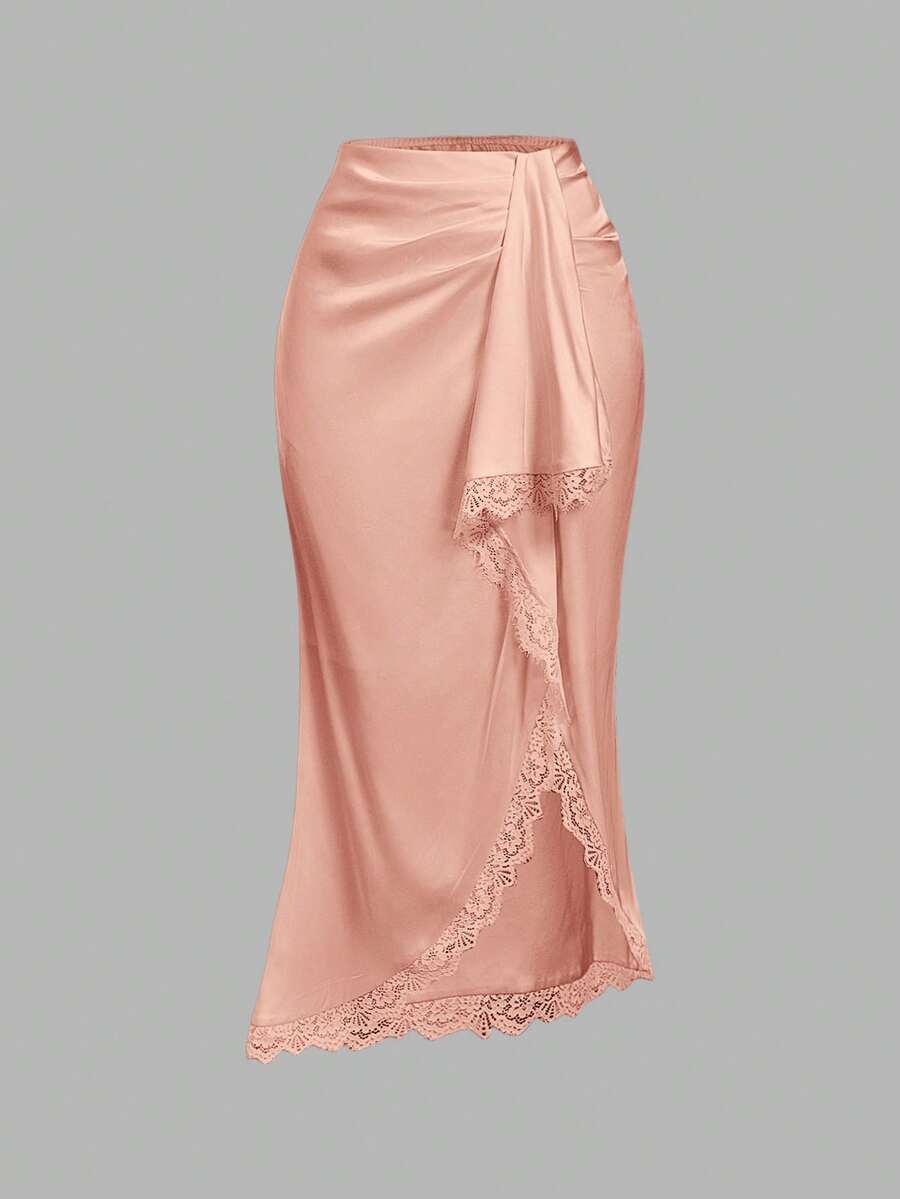 Women's elegant pink satin asymmetrical long skirt featuring contrast lace patchwork, ruched knot detailing, and a mid-waist mermaid cut.