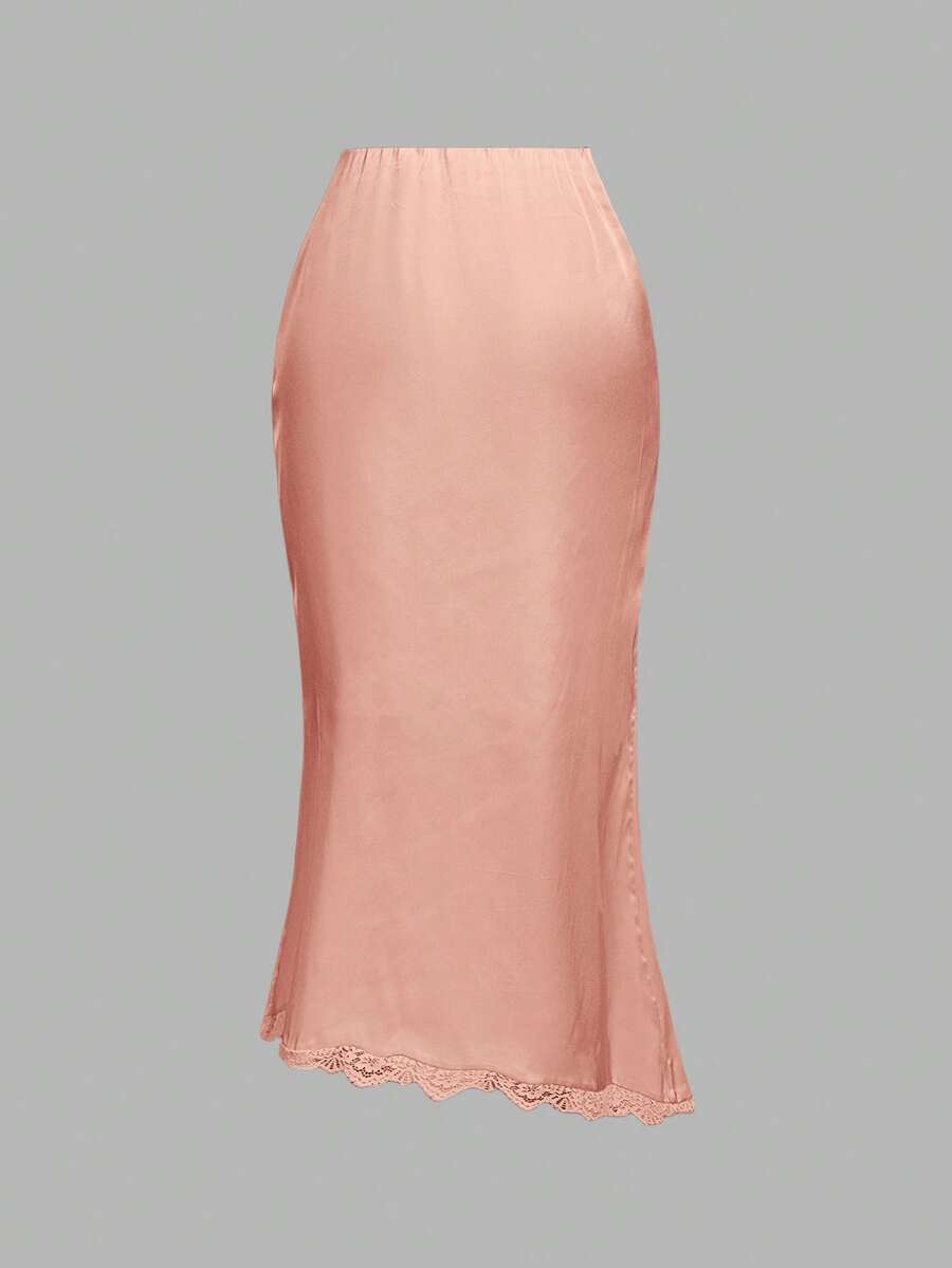 Women's elegant pink satin asymmetrical long skirt featuring contrast lace patchwork, ruched knot detailing, and a mid-waist mermaid cut.