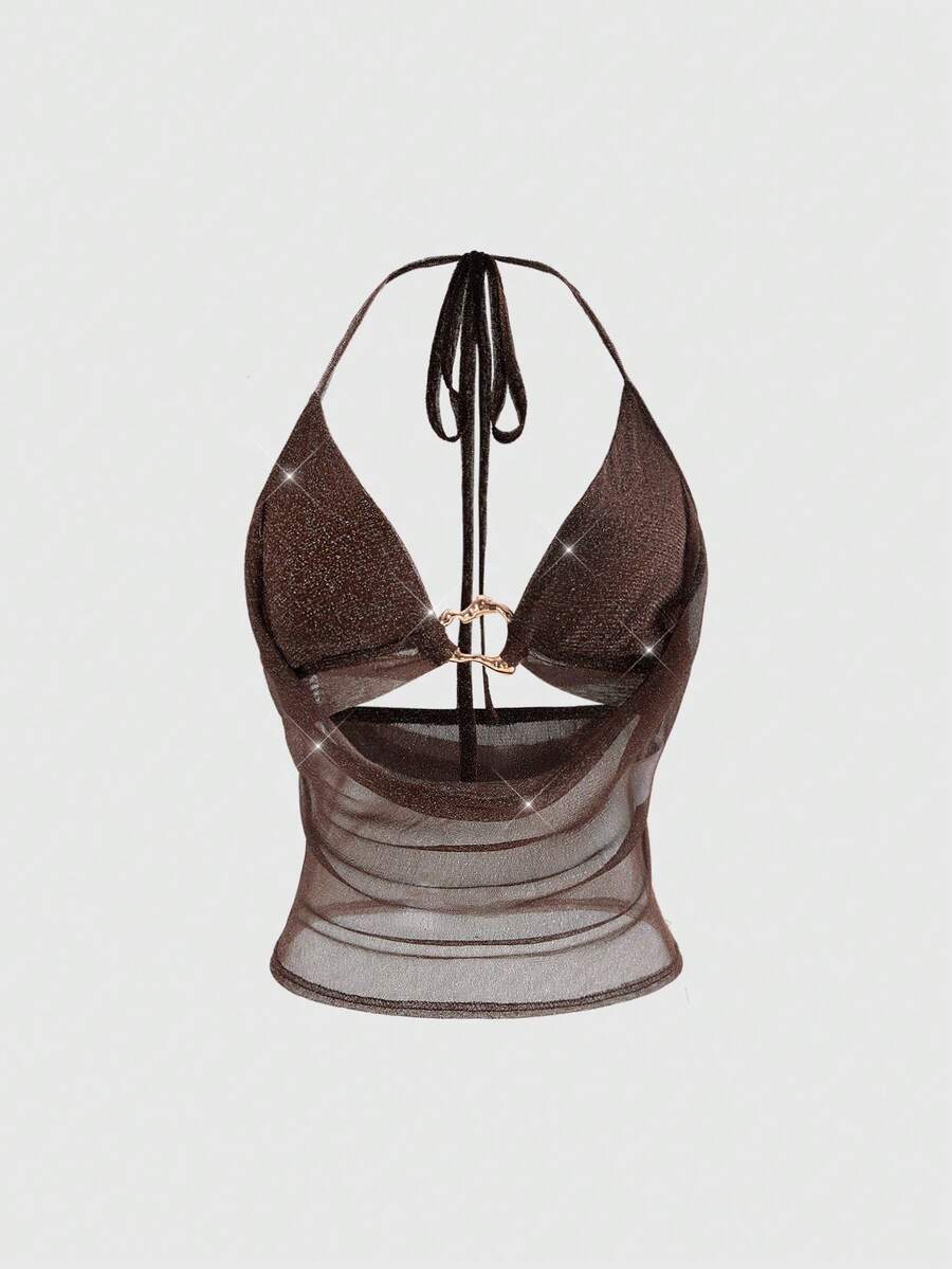 Women's glitter backless halter crop top with a draped neck and tie-up straps in metallic black knit fabric.