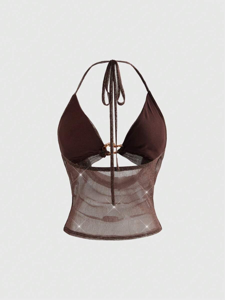 Women's glitter backless halter crop top with a draped neck and tie-up straps in metallic black knit fabric.