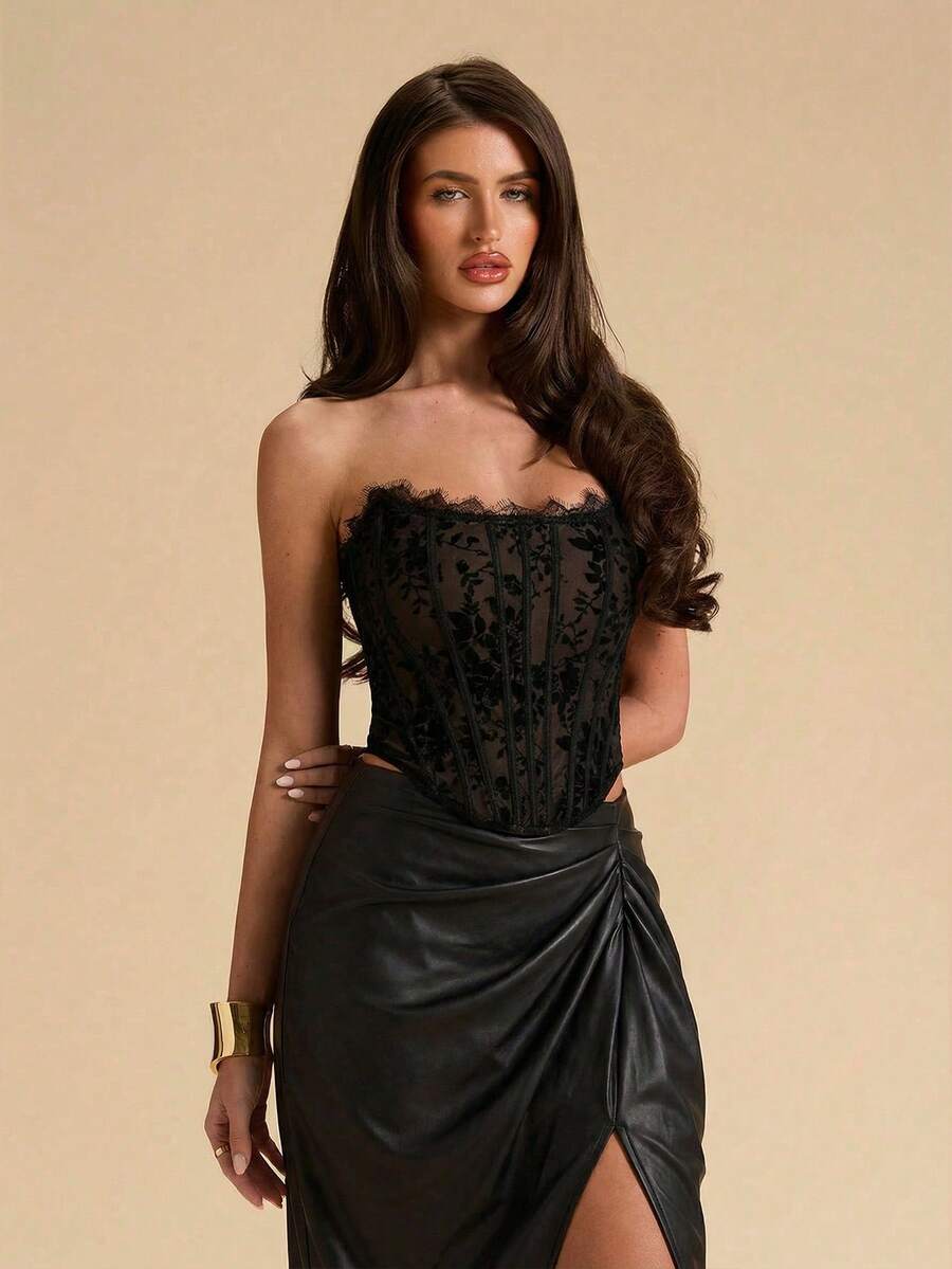 Women's strapless bustier crop top with contrast lace, lace-up detail, and an asymmetric hem in a slim-fit satin finish.
