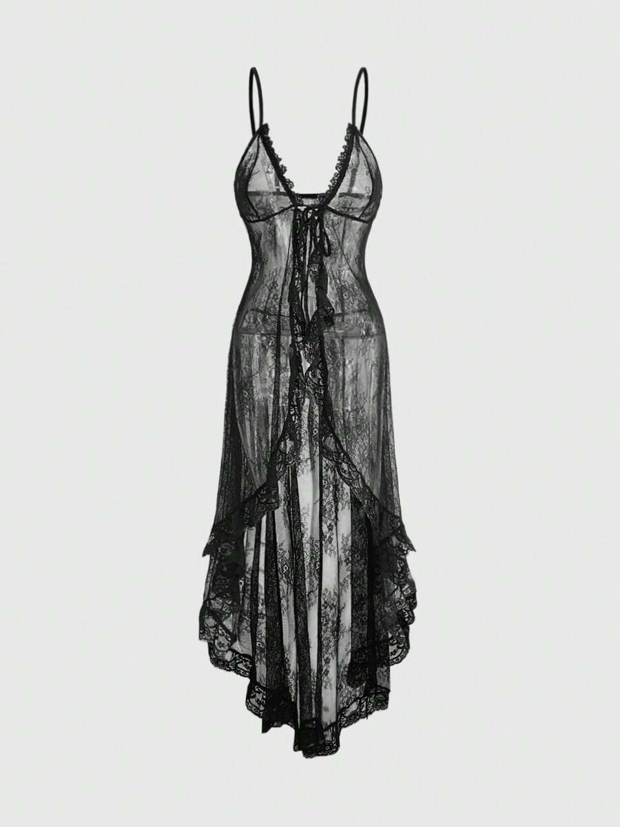 Woman wearing a black sheer lace maxi dress with spaghetti straps, high waist split thigh, and asymmetrical hem.