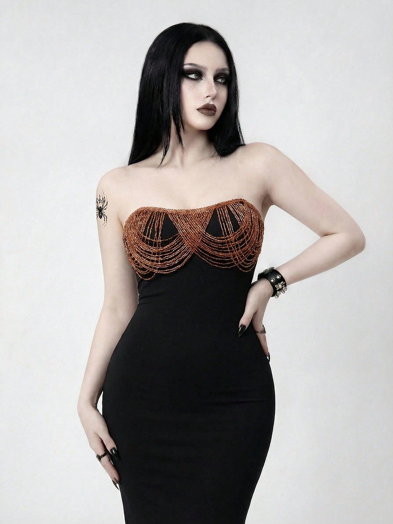 Black strapless bodycon maxi dress featuring a backless design, split thigh, and matching long arm sleeves.