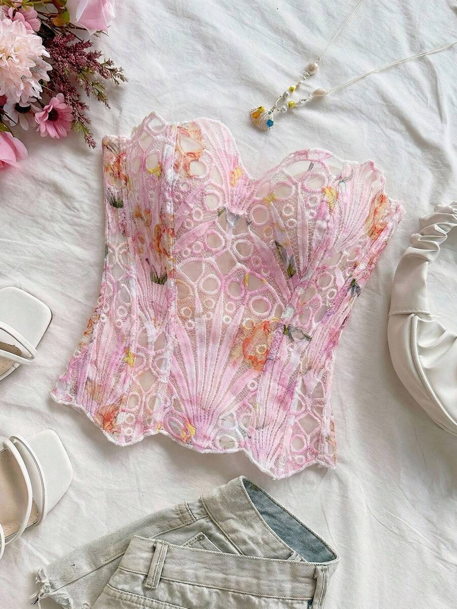 Strapless floral corset top with lace-up detail, asymmetrical hem, and slim fit for women in a boho vacation style.