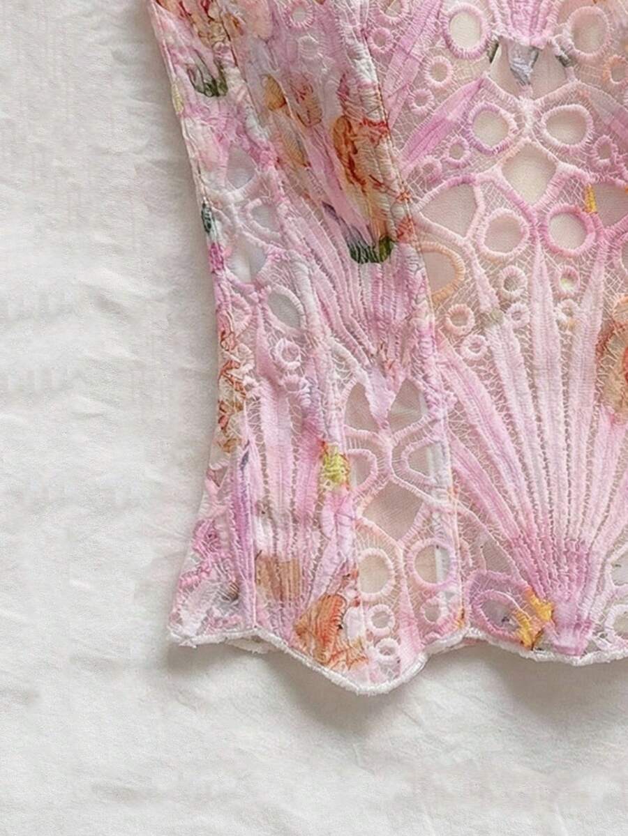 Strapless floral corset top with lace-up detail, asymmetrical hem, and slim fit for women in a boho vacation style.