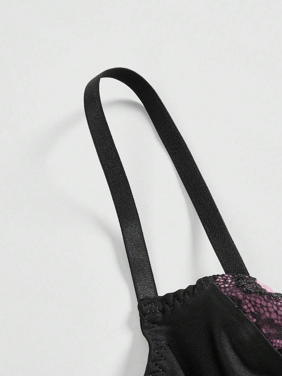 ROMWE women's black Goth Y2K contrast lace spaghetti strap cami crop top featuring bow details and waist tie decor.