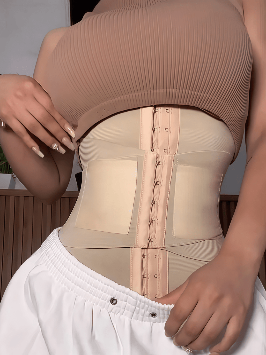 Women's high compression waist trainer and abdominal shaper belt designed for tummy support and daily wear.