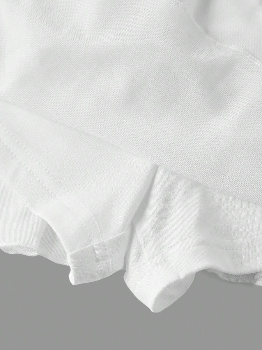 Black low waist tiered mini skirt featuring a ruffle hem and ring accent detail on knitted stretch fabric for women.