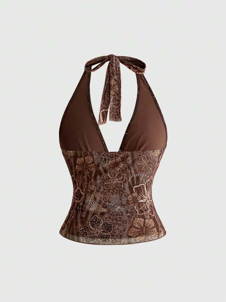 Women's pink tropical hibiscus print halter top featuring contrast lace trim and a slim fit silhouette.