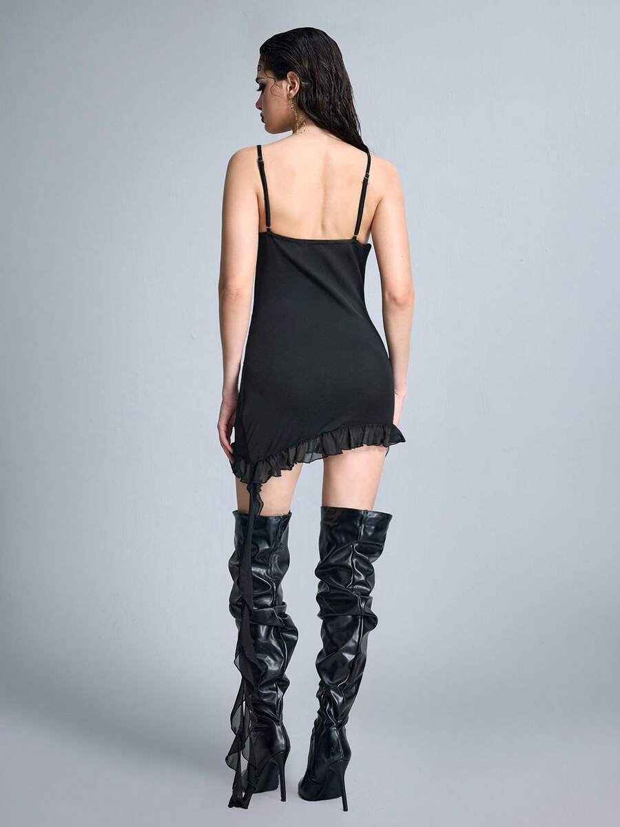 Black semi-sheer goth bodycon mini dress featuring spaghetti straps, studded details, flounce hem, and mesh fabric.