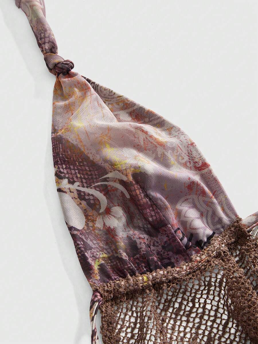 Multicolor knitted halter crop top featuring floral and zebra stripe pattern with draped neck, 3D rose detail, asymmetrical hem, and matching separate arm sleeves.