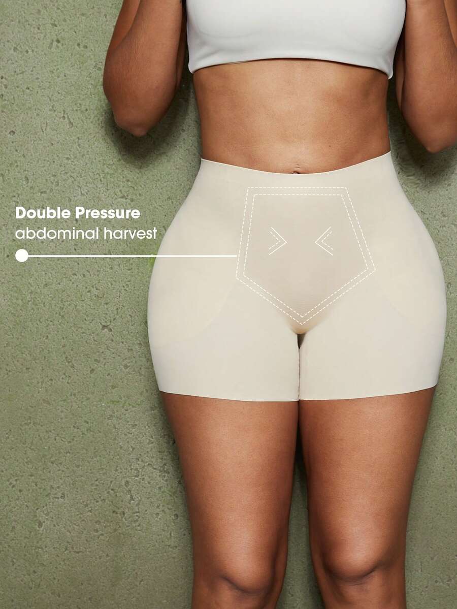 Women's black seamless waist trainer shorts featuring tummy control and butt lifting pads