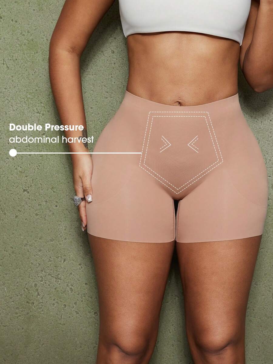 Women's black seamless waist trainer shorts featuring tummy control and butt lifting pads