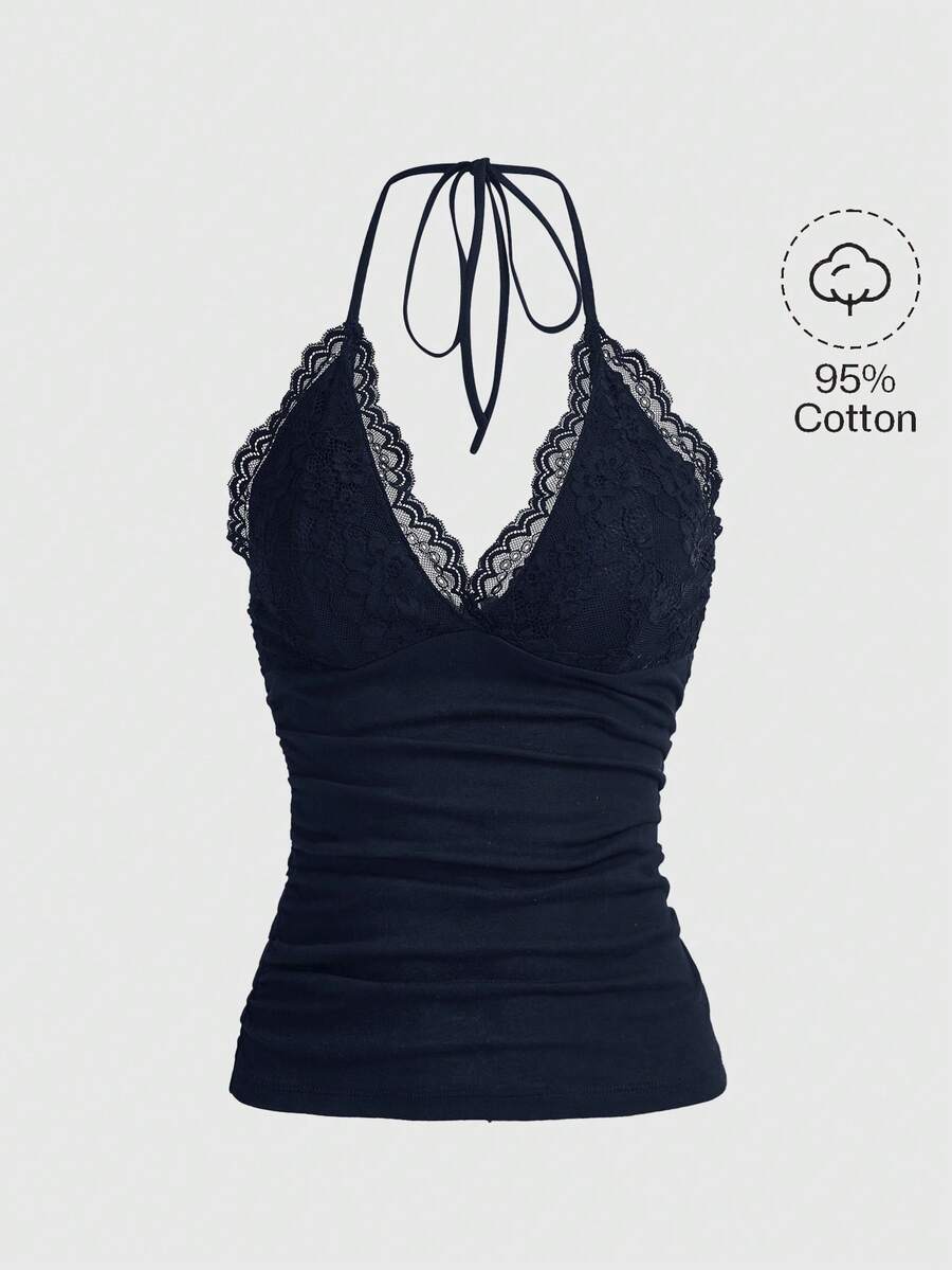 A women's black backless halter top featuring contrast lace trim, ruched front detail, and slim fit soft knitted fabric.