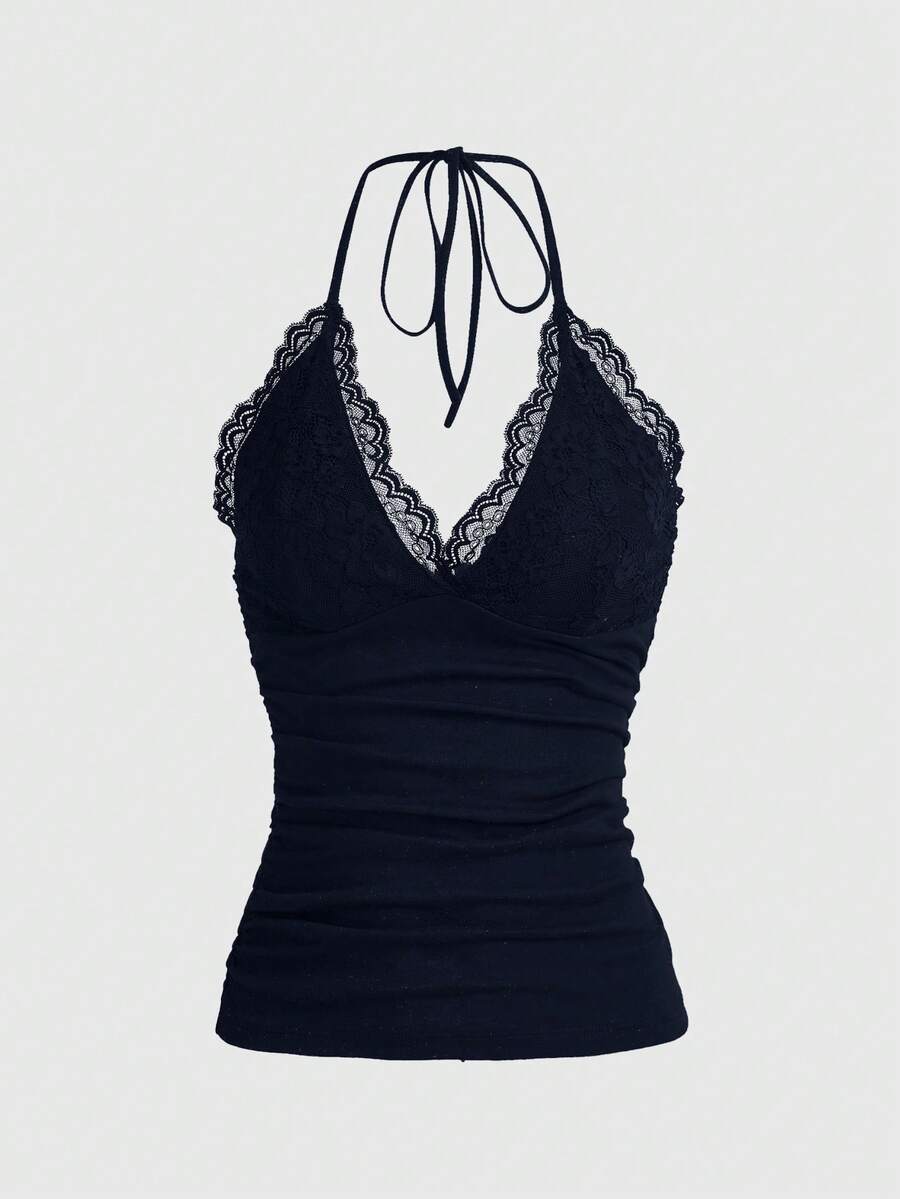 A women's black backless halter top featuring contrast lace trim, ruched front detail, and slim fit soft knitted fabric.