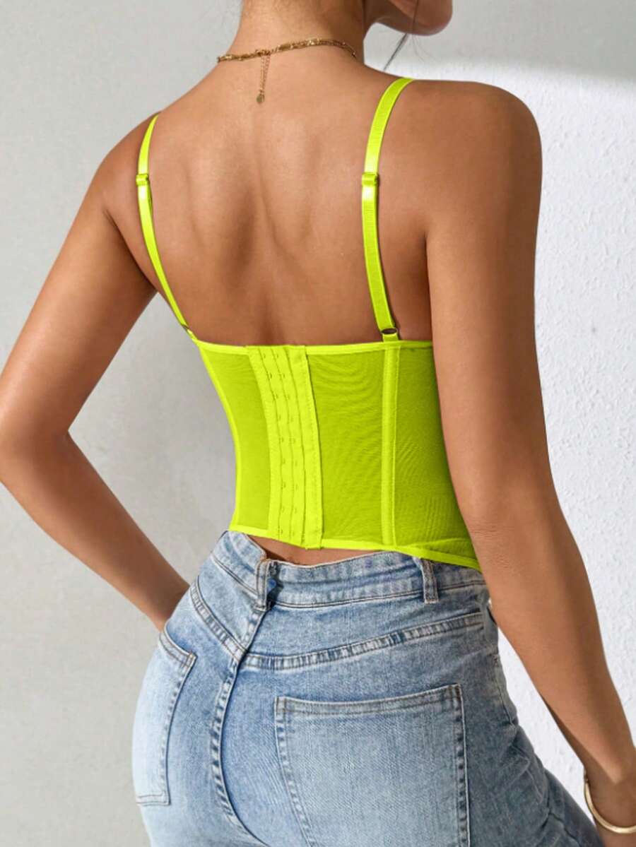 Black lace bustier corset top for women with buckle detail, spaghetti straps, slim fit, and lightweight mesh fabric for a night out look.