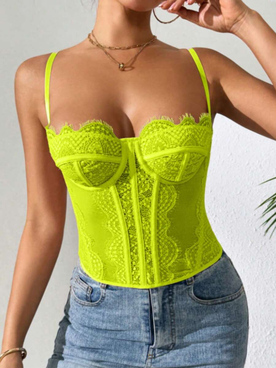 Black lace bustier corset top for women with buckle detail, spaghetti straps, slim fit, and lightweight mesh fabric for a night out look.