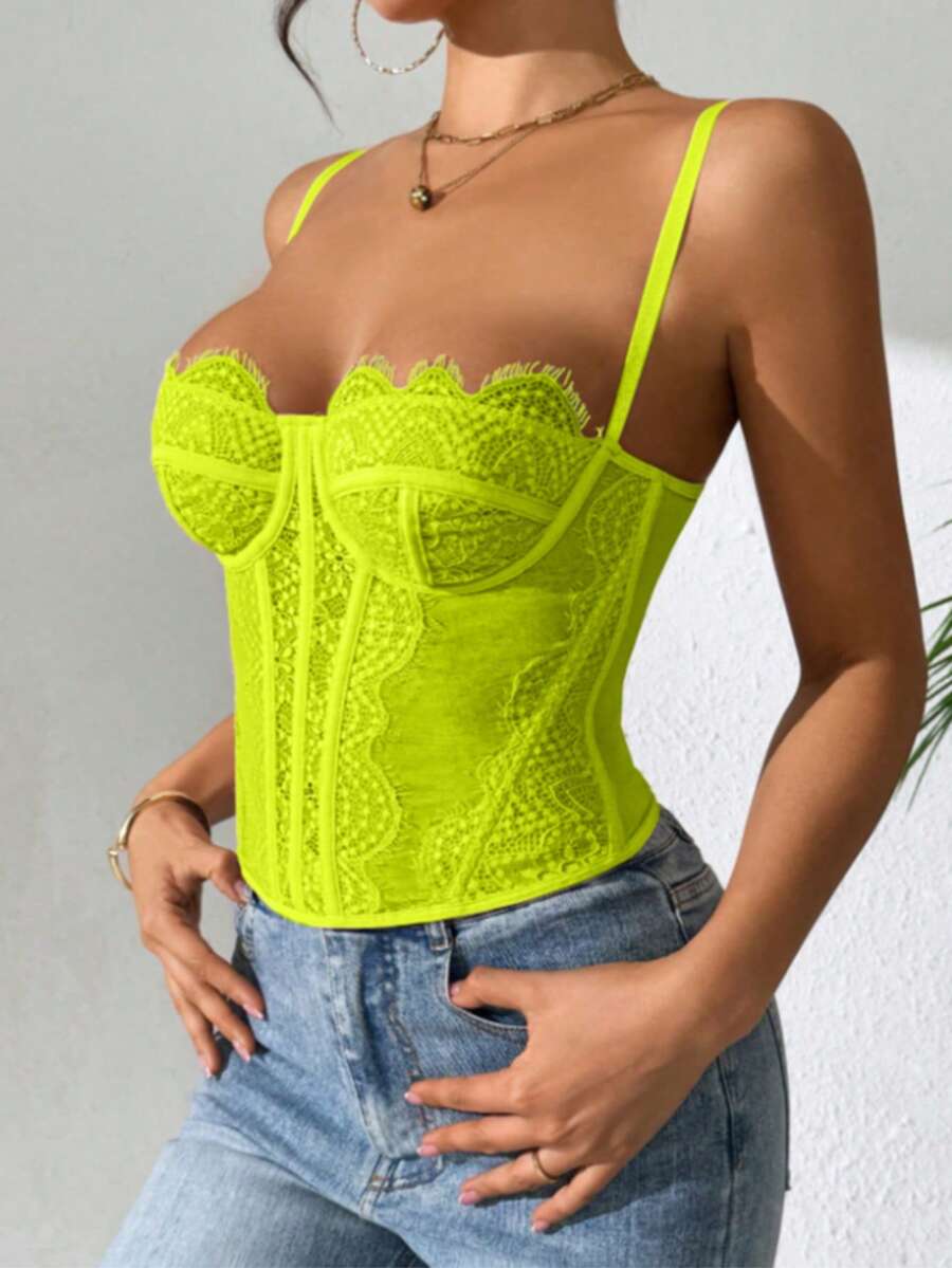 Black lace bustier corset top for women with buckle detail, spaghetti straps, slim fit, and lightweight mesh fabric for a night out look.