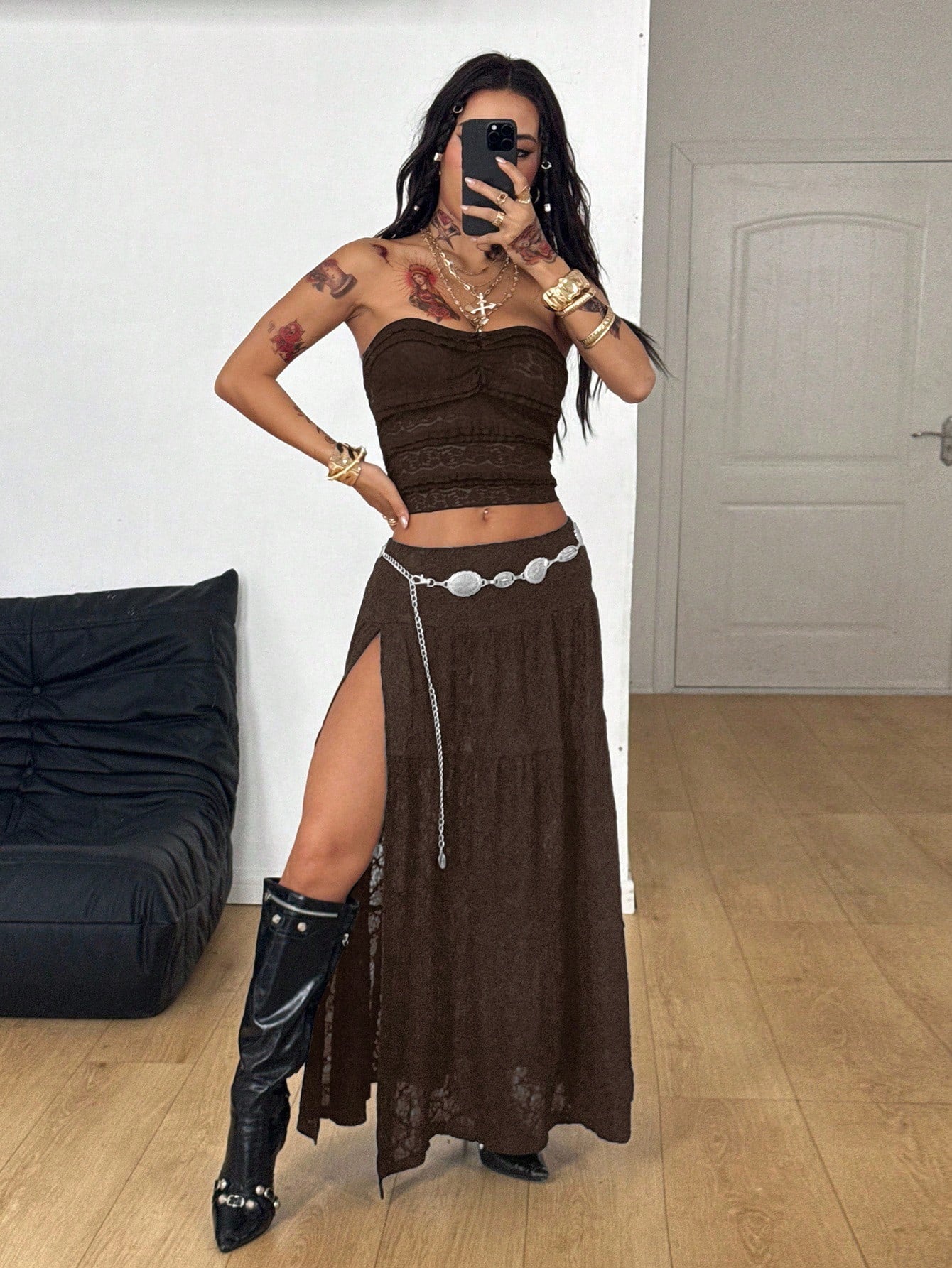 Women's black low waist split thigh long skirt featuring semi-sheer textured fabric and a flared skinny fit.
