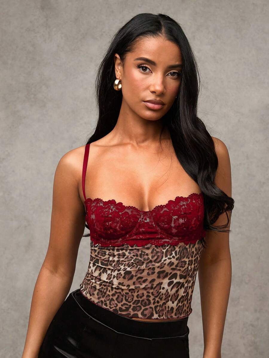 Women's black contrast lace camisole with spaghetti straps, cup detail, semi-sheer finish, and slim fit for going out or date night.