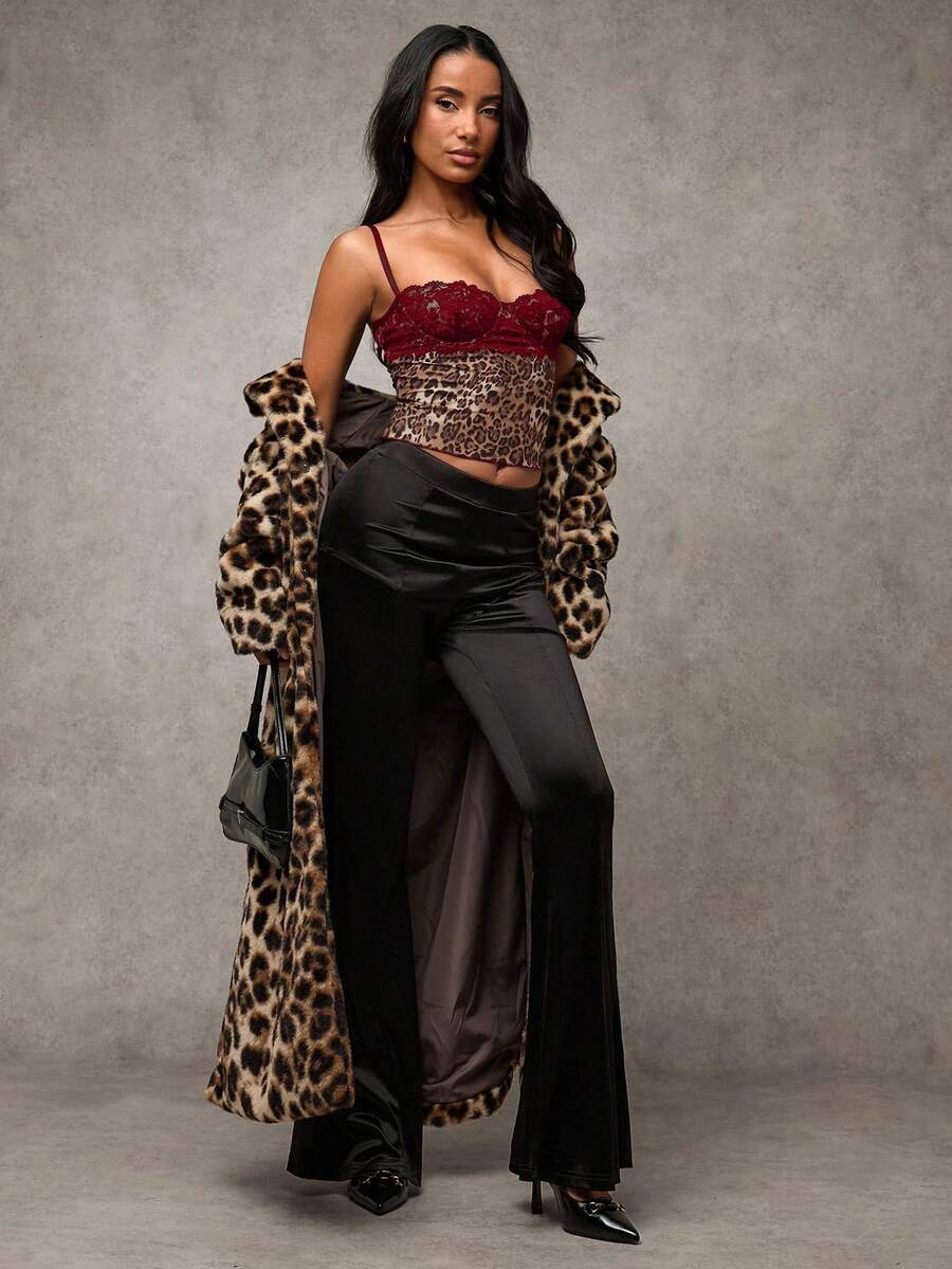 Women's black contrast lace camisole with spaghetti straps, cup detail, semi-sheer finish, and slim fit for going out or date night.