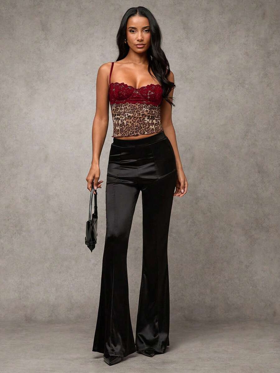 Women's black contrast lace camisole with spaghetti straps, cup detail, semi-sheer finish, and slim fit for going out or date night.