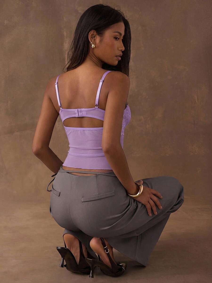 Women's black contrast lace camisole with spaghetti straps, cup detail, semi-sheer finish, and slim fit for going out or date night.