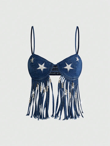 Blue denim camisole top for women featuring star patch detailing, fringe tassel asymmetrical hem, and spaghetti straps.