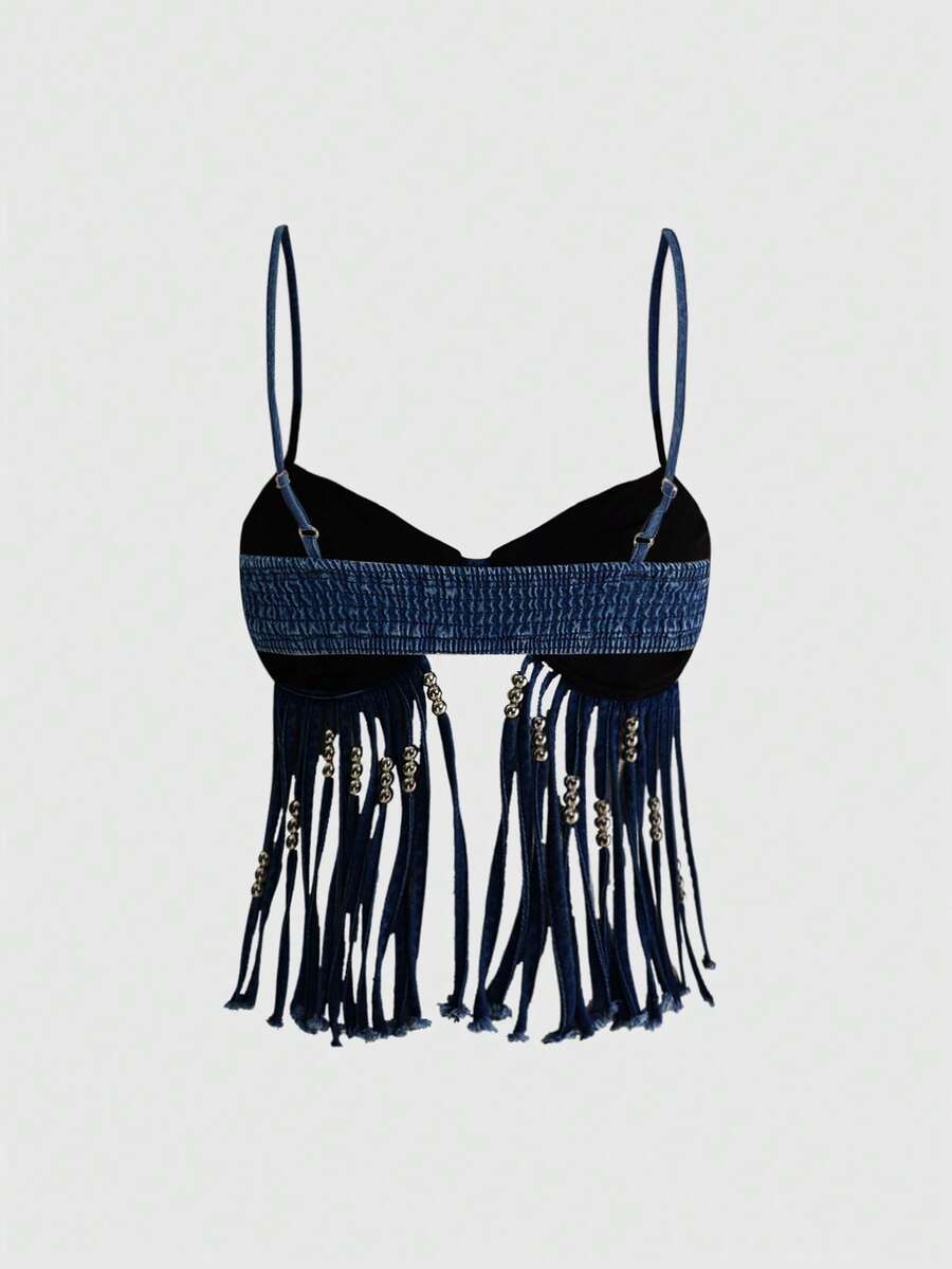 Blue denim camisole top for women featuring star patch detailing, fringe tassel asymmetrical hem, and spaghetti straps.