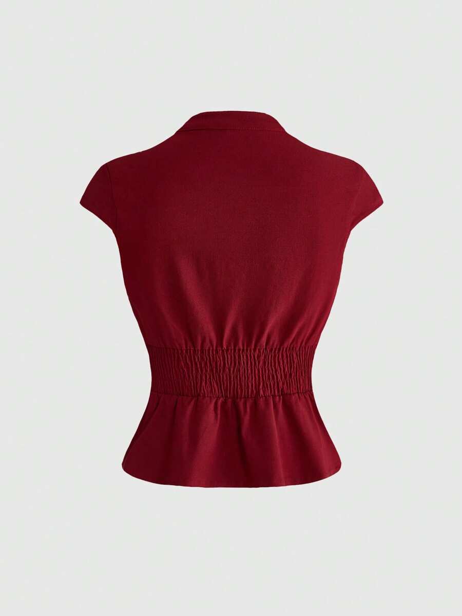 Women's black deep V-neck top featuring cap sleeves, cut-out lace-up details, zipper closure, and regular fit woven fabric.