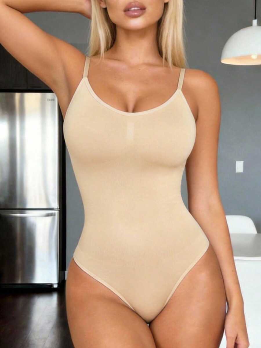 Brown seamless shapewear bodysuit featuring backless design, thong bottom, non-removable padding, and high-stretch fabric for tummy and waist control.