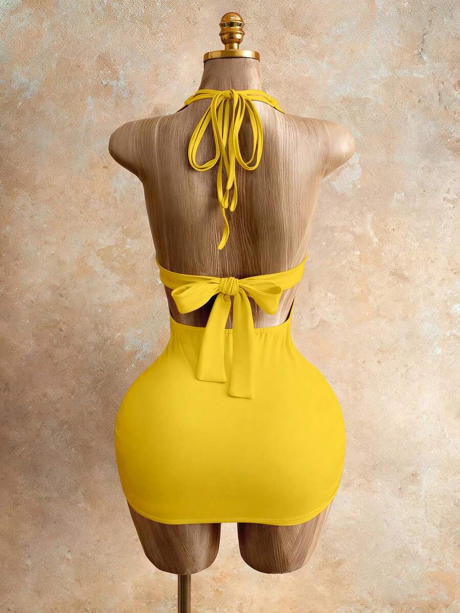 Sleeveless women's halter backless bodycon mini dress featuring lace-up knot back details and a high-waist pencil hem.